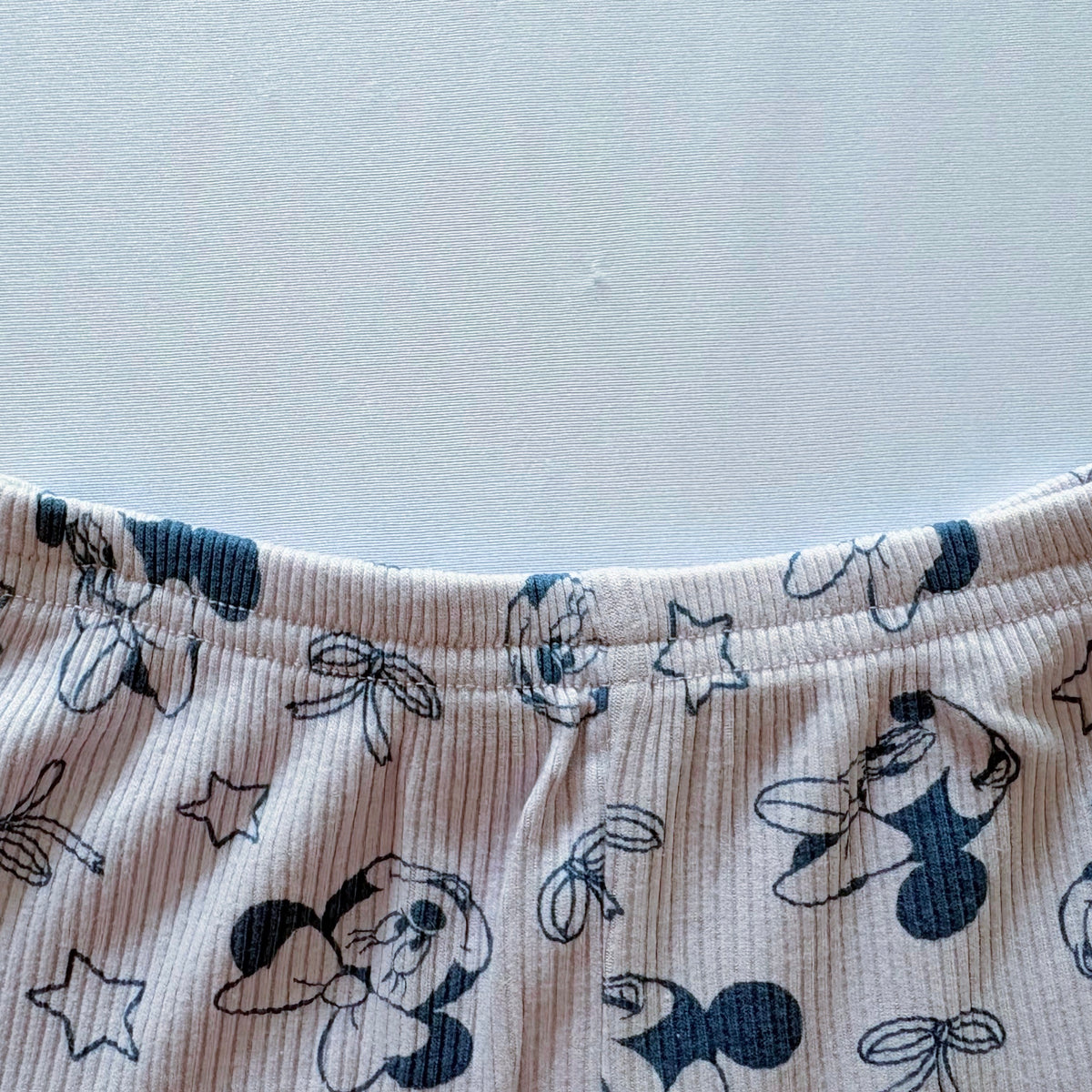 Close-up of the elastic waistband on the Bow & Bloom Ribbed Cotton Shorts.