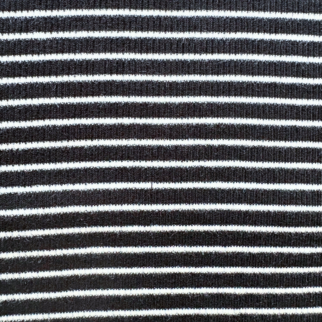 Close-up of the black and white horizontal stripe pattern on the Classic Stripes ribbed cotton co-ord set.