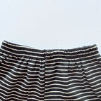 Close-up of the elastic waistband on the Classic Stripes ribbed cotton shorts.