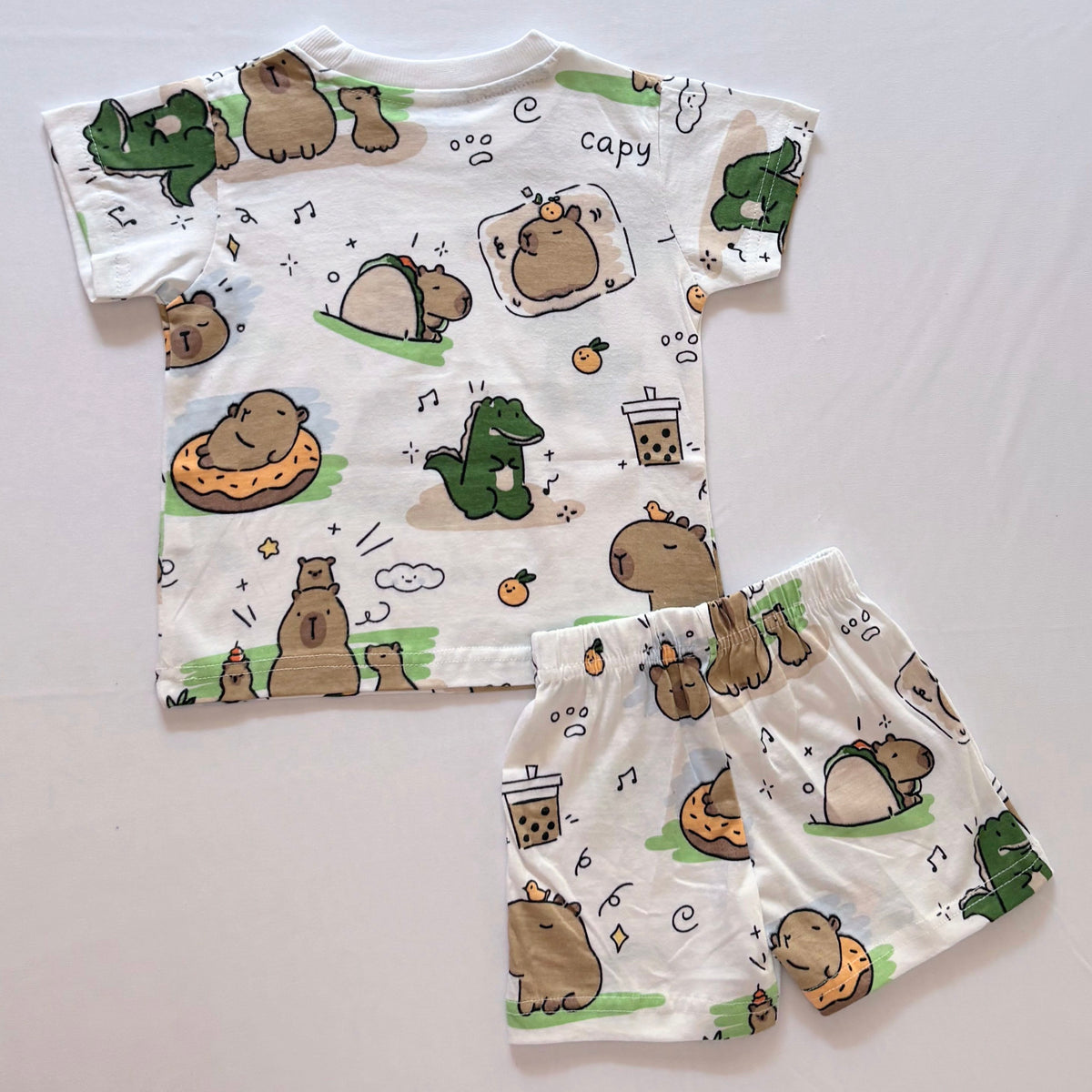 Cozy Capybara Cotton Co-ord Set for kids in White with Capybara, Dinosaur, Bubble Tea and Orange print - Back View.