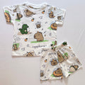 Cozy Capybara Cotton Co-ord Set for kids in White with Capybara, Dinosaur, Bubble Tea and Orange print - Front View.