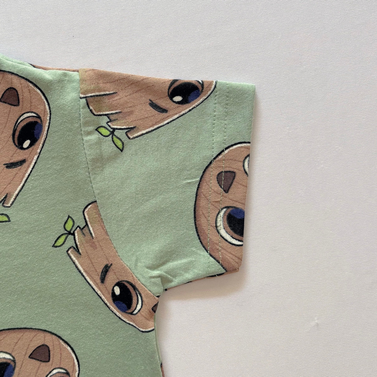 Close-up of the sleeve on the Forest Buddy Cotton T-shirt.