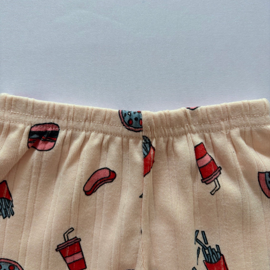 Close-up of the elastic waistband on the Happy Bites Ribbed Cotton Shorts.