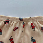 Close-up of the elastic waistband on the Happy Bites Ribbed Cotton Shorts.