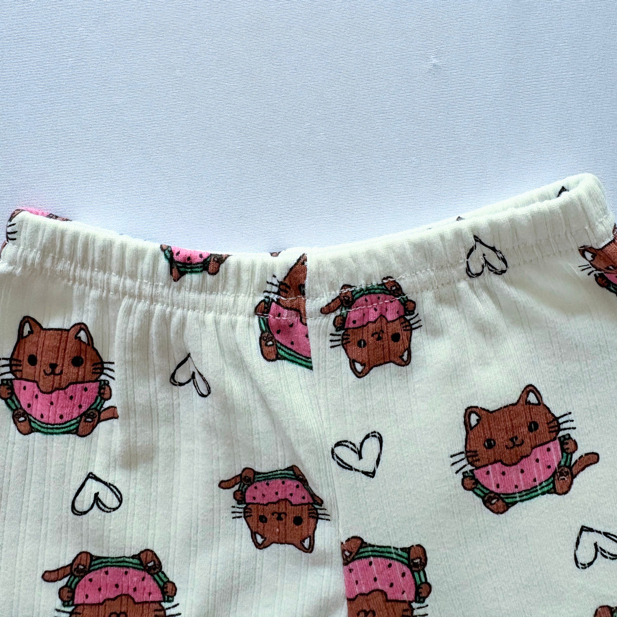 Close-up of the elastic waistband on the Melon Mews Ribbed Cotton Shorts.
