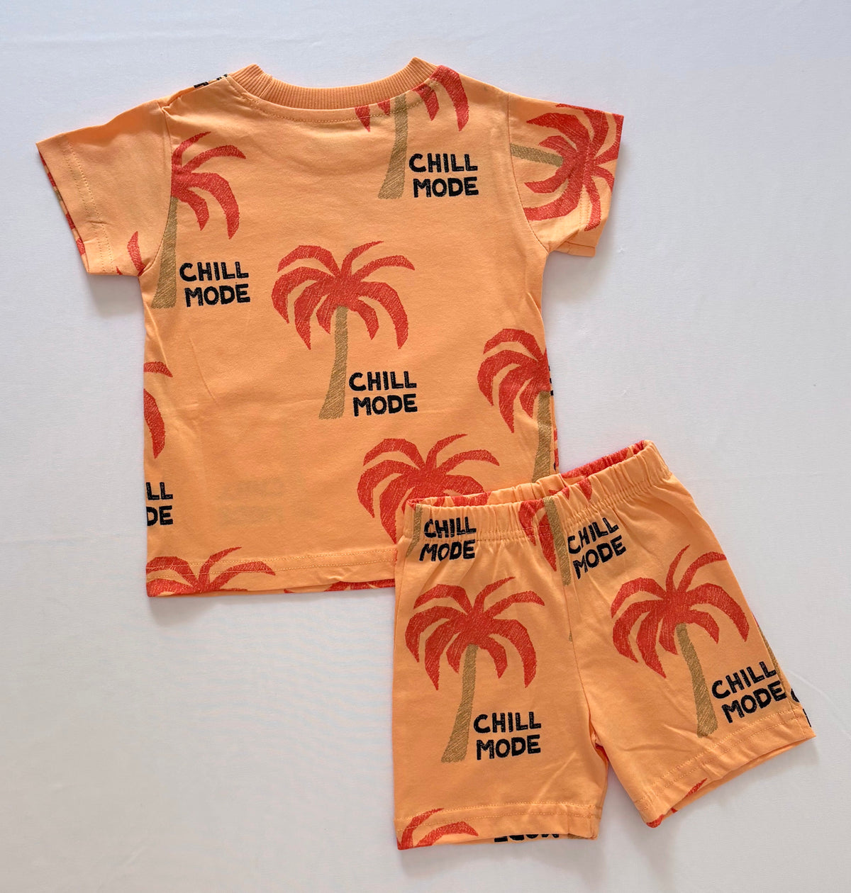 Palm Paradise Cotton Co-ord Set for Kids in orange with red palm tree print and black "CHILL MODE" Text - Back View 