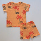 Palm Paradise Cotton Co-ord Set for Kids in orange with red palm tree print and black "CHILL MODE" Text - Front View 