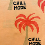 Close-up of the red palm tree print and black "CHILL MODE" text on the Palm Paradise Cotton Co-ord Set.