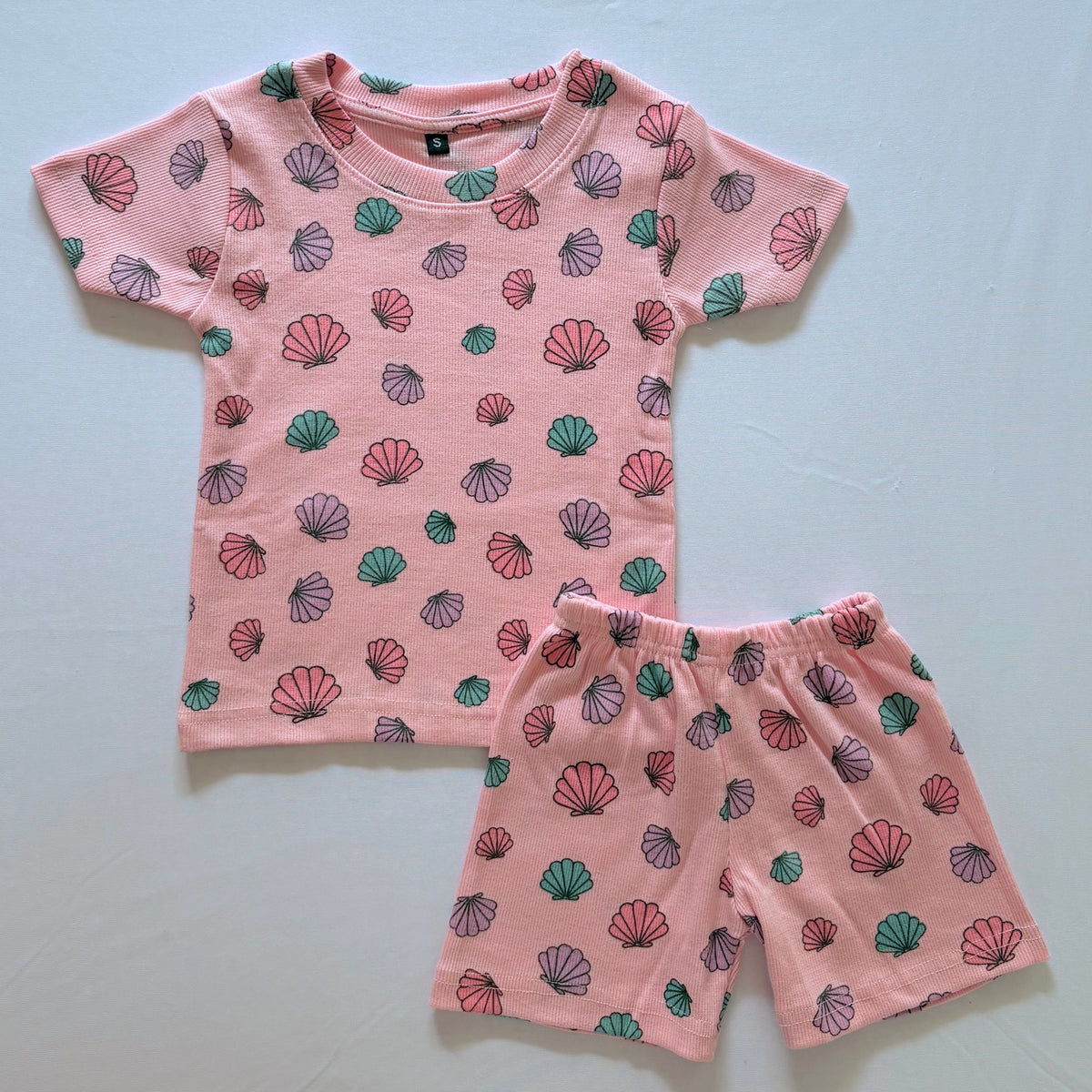 Shell Treasures Ribbed Cotton Co-ord Set for kids in peach with colourful Shell prints - Front View.