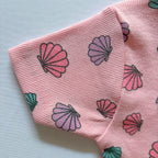 Close-up of the sleeve and ribbed cotton fabric on the Shell Treasures T-shirt.