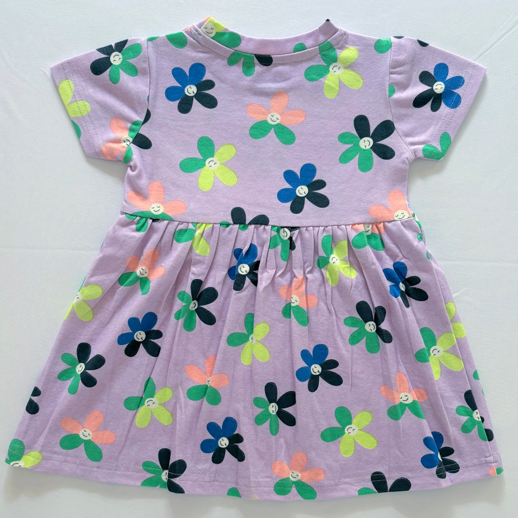 Smiley Blooms Cotton Frock for Girls in Lavender with Colourful Flower Print - Back View.