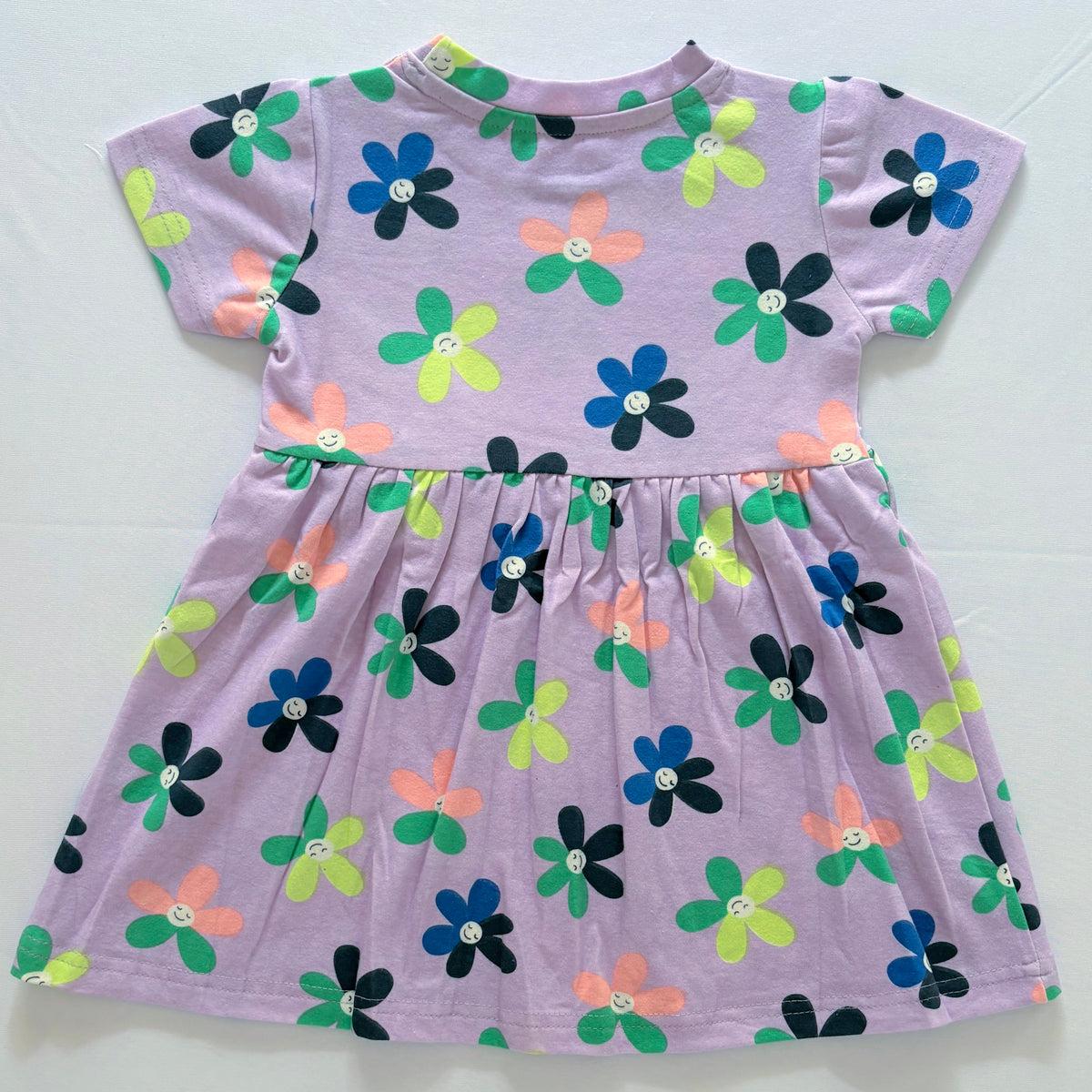 Smiley Blooms Cotton Frock for Girls in Lavender with Colourful Flower Print - Back View.