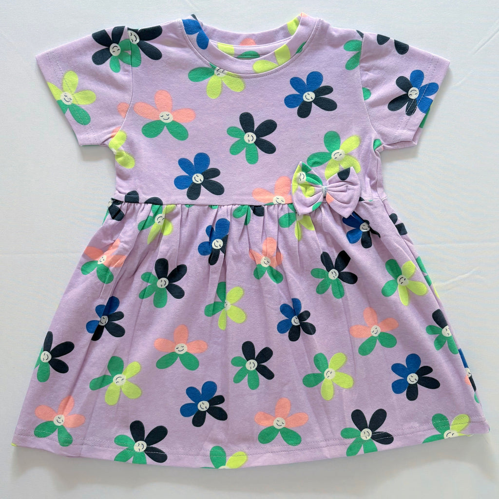 Smiley Blooms Cotton Frock for Girls in Lavender with Colourful Flower Print - Front View.