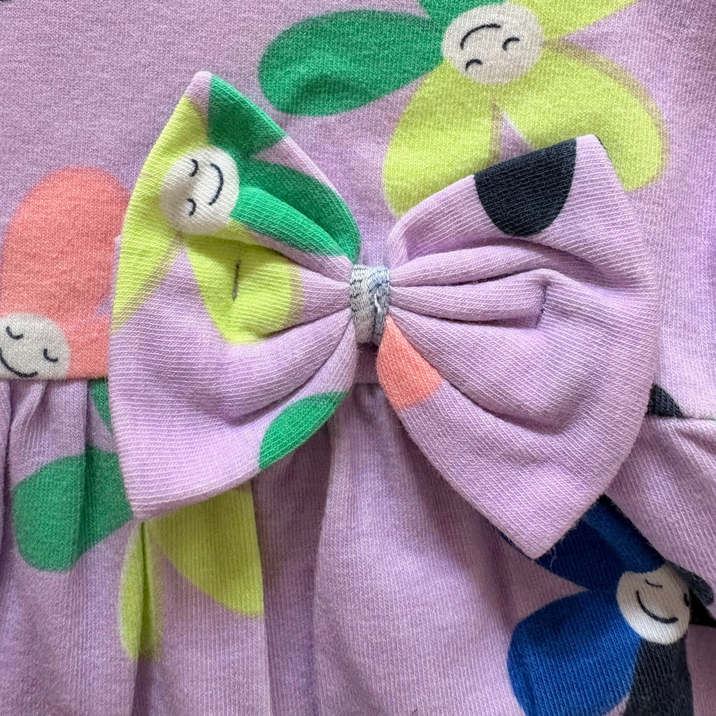 Close-up of the Colourful Flower Print and Bow on the Smiley Blooms Cotton Frock.