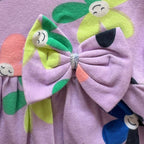Close-up of the Colourful Flower Print and Bow on the Smiley Blooms Cotton Frock.