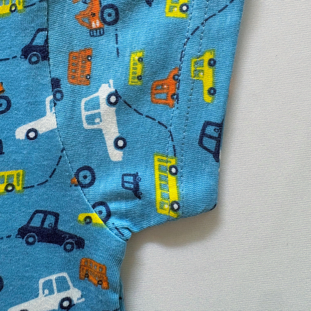 Close-up of the sleeve on the Tiny Travels Cotton T-shirt.