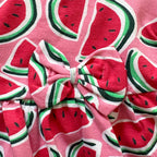 Close-up of the Watermelon Print and Bow on the Watermelon Splash Cotton Frock.