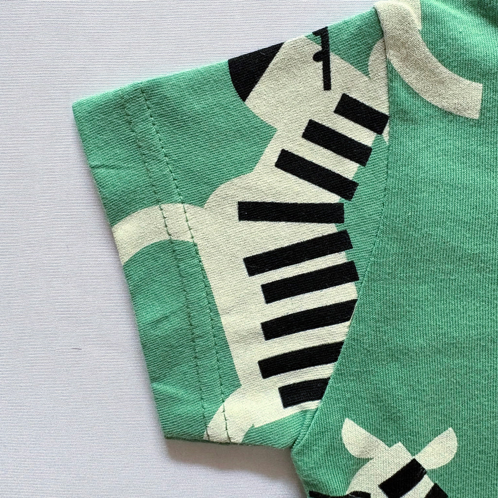 Close-up of the sleeve on the Zippy Zebra Cotton T-shirt.