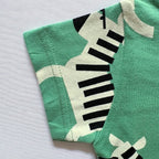 Close-up of the sleeve on the Zippy Zebra Cotton T-shirt.